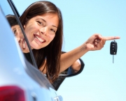 Driver woman showing new car keys