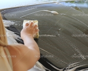 woman hand hold sponge washing car